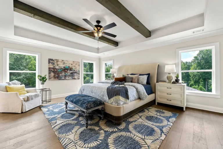 CAD Home Crafters & Designs Bedroom with luxury master's suites & wings curated with custom vaulted ceilings, rafters, and floor to ceiling windows.