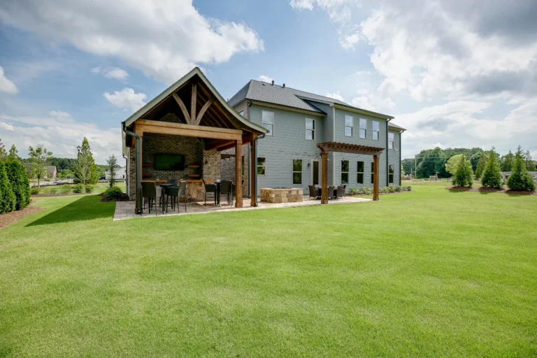 CAD Home Crafters & Designs - Builder for custom homes Craftsman style home in Rockingham County, NC, craftsman style home with outdoor kitchen and trellis