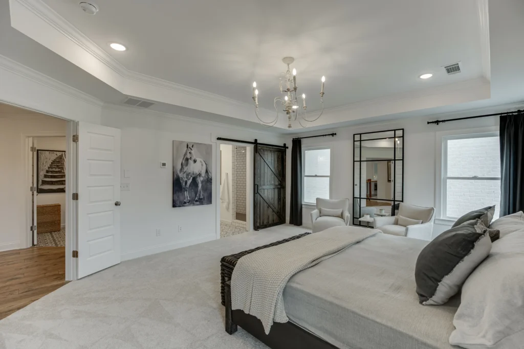 CAD Home Crafters & Designs - Builder for custom homes Craftsman style home in Rockingham County, NC, owner's wing with chandelier, tray ceilings and recessed lighting, master bathroom with double shower and double vanities